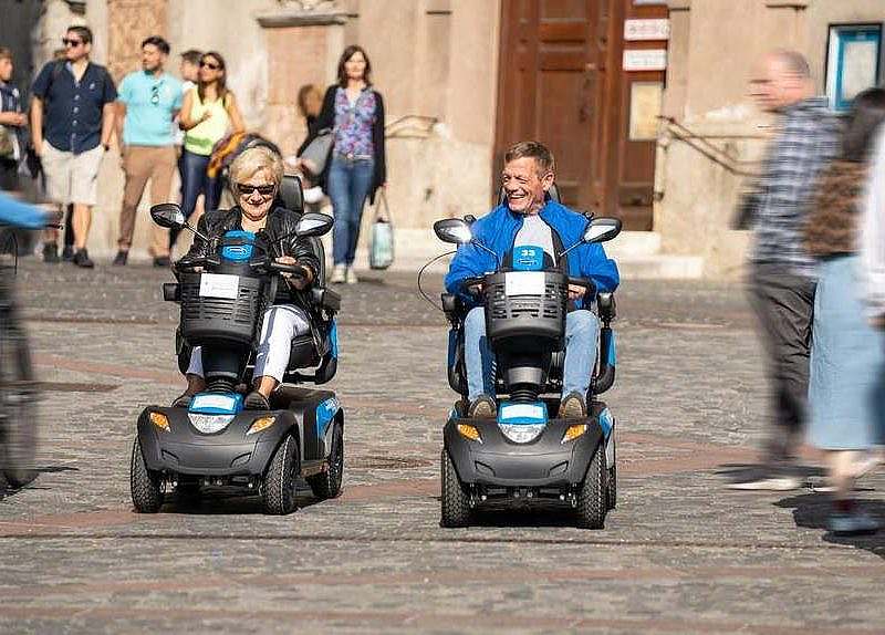 Two people on electric scooters