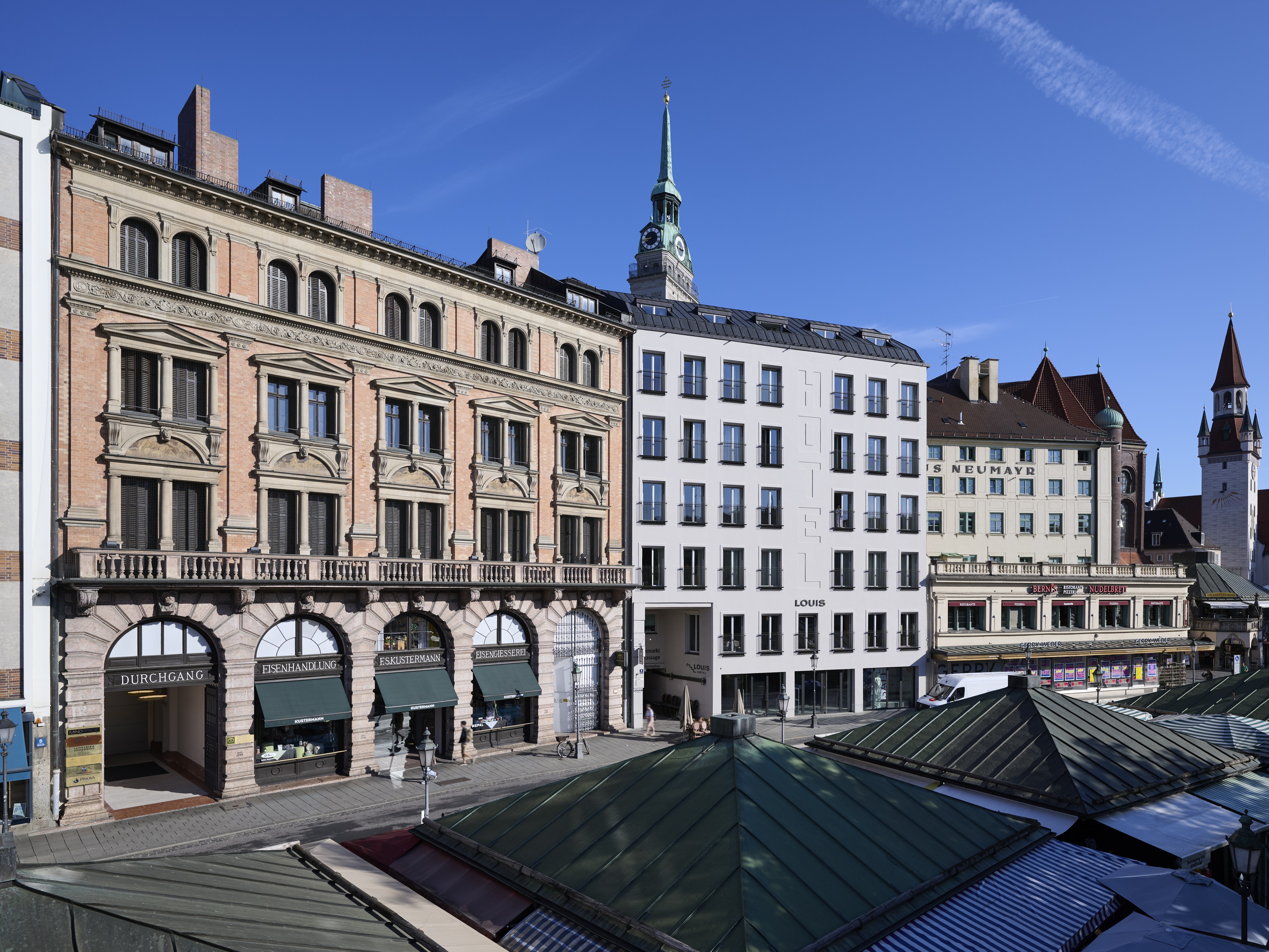 House façade with arched shop windows on the ground floor