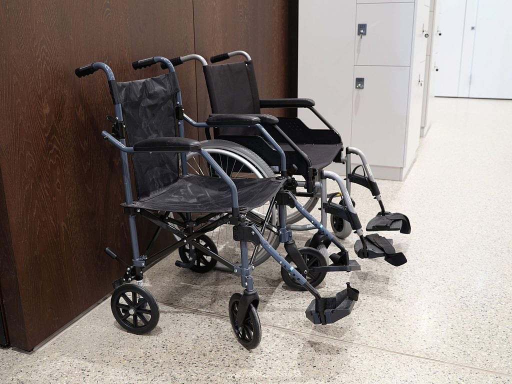 Two wheelchairs of different types