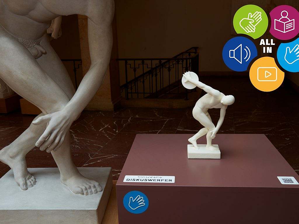 A small cast model of a discus thrower, mounted on a plinth, which visitors can touch